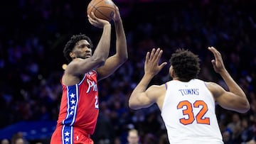 Philadelphia 76ers center Joel Embiid (21) shoots the ball in front of New York Knicks center Karl-Anthony Towns (32) during the third quarter at Wells Fargo Center.