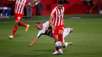 GIRONA, SPAIN - AUGUST 23: Juan Francisco Martinez 'Nino' of Elche CF collides with Juan Pedro 'Juanpe' Ramirez of Girona FC during the La Liga Smartbank Playoffs match between Girona FC and Elche CF at Montilivi Stadium on August 23,