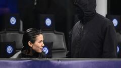 US rapper Kanye West (R) and girlfriend Bianca Censori are seen in the stands during the UEFA Champions League last 16 first leg football match Inter Milan vs Atletico Madrid at the San Siro stadium in Milan on February 20, 2024. (Photo by Marco BERTORELLO / AFP)