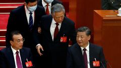 FILE PHOTO: Former Chinese president Hu Jintao leaves his seat next to Chinese President Xi Jinping and Premier Li Keqiang, during the closing ceremony of the 20th National Congress of the Communist Party of China, at the Great Hall of the People in Beijing, China October 22, 2022. REUTERS/Tingshu Wang/File Photo