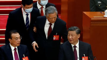 FILE PHOTO: Former Chinese president Hu Jintao leaves his seat next to Chinese President Xi Jinping and Premier Li Keqiang, during the closing ceremony of the 20th National Congress of the Communist Party of China, at the Great Hall of the People in Beijing, China October 22, 2022. REUTERS/Tingshu Wang/File Photo