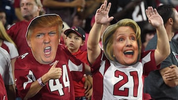 GLENDALE, AZ - OCTOBER 17:  Arizona Cardinals fans wear masks of Presidential candidates Donald Trump and Hillary Clinton during the NFL game between the New York Jets and Arizona Cardinals at University of Phoenix Stadium on October 17, 2016 in Glendale, Arizona.  (Photo by Norm Hall/Getty Images)