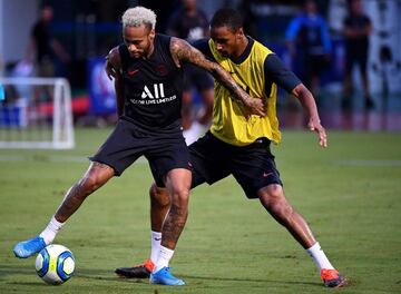 Paris Saint-Germain's Brazilian forward Neymar (L) fights for the ball with Paris Saint-Germain's French defender Abdou Diallo during a training session at The Xixiang Sports Centre in Shenzhen on August 1, 2019, ahead of the French Trophy of Champions fo