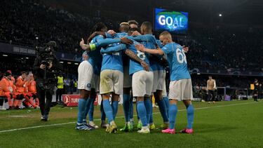 Napoli's players celebrate after Nigerian forward #09 Victor Osimhen scored a goal during the UEFA Champions League round of 16 first Leg football match between Napoli and Barcelona at the Diego-Armando-Maradona stadium in Naples on February 21, 2024. (Photo by Tiziana FABI / AFP)