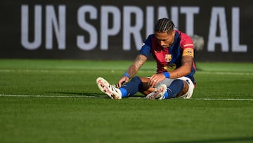 Barcelona's Brazilian forward #11 Raphinha (R) reacts during the Spanish league football match between FC Barcelona and UD Las Palmas at the Estadi Olimpic Lluis Companys in Barcelona on November 30, 2024. (Photo by Josep LAGO / AFP)