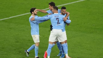 DORTMUND, GERMANY - APRIL 14: Riyad Mahrez of Manchester City celebrates with team mates Kyle Walker, Rodrigo and Bernardo Silva after scoring their side's first goal during the UEFA Champions League Quarter Final Second Leg match between Borussia Do
