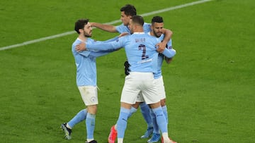 DORTMUND, GERMANY - APRIL 14: Riyad Mahrez of Manchester City celebrates with team mates Kyle Walker, Rodrigo and Bernardo Silva after scoring their side&#039;s first goal during the UEFA Champions League Quarter Final Second Leg match between Borussia Do