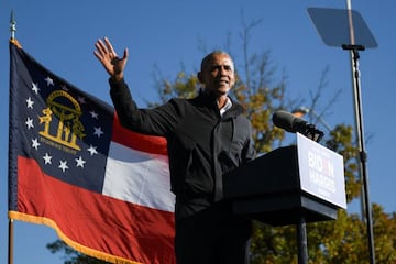 Former President Barack Obama addresses voters one day before the election, in Atlanta, Georgia.