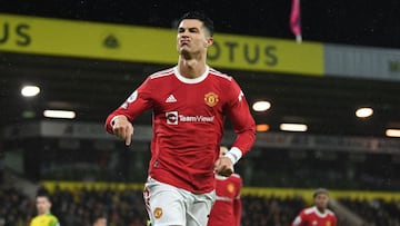 Manchester United's Portuguese striker Cristiano Ronaldo celebrates after scoring the opening goal from the penalty spot during the English Premier League football match between Norwich City and Manchester United at Carrow Road Stadium in Norwich, ea