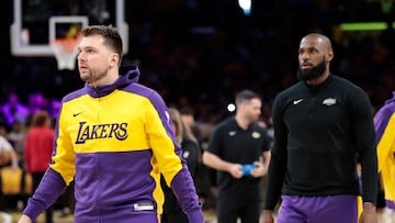LOS ANGELES, CALIFORNIA - APRIL 19: Luka Doncic #77 and LeBron James #23 of the Los Angeles Lakers warms up prior to the game against the Minnesota Timberwolves in Game One of the Western Conference First Round NBA Playoffs at Crypto.com Arena on April 19, 2025 in Los Angeles, California. NOTE TO USER: User expressly acknowledges and agrees that, by downloading and or using this photograph, User is consenting to the terms and conditions of the Getty Images License Agreement. Ronald Martinez/Getty Images/AFP (Photo by RONALD MARTINEZ / GETTY IMAGES NORTH AMERICA / Getty Images via AFP)