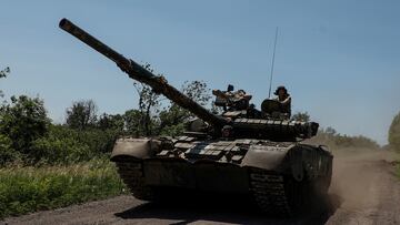 FILE PHOTO: Ukrainian servicemen of the 30th Kostiantyn Ostrozkyi Separate Mechanized Brigade ride in a T-80 main battle tank captured earlier from Russian troops, along a road near the front line town of Bakhmut, amid Russia's attack on Ukraine, in Donetsk region, Ukraine June 19, 2023. Radio Free Europe/Radio Liberty/Serhii Nuzhnenko via REUTERS/File Photo