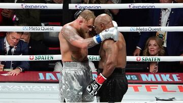 US retired pro-boxer Mike Tyson (R) and US YouTuber/boxer Jake Paul (L) hug after Paul defeated Tyson in their heavyweight boxing bout at The Pavilion at AT&T Stadium in Arlington, Texas, November 15, 2024. (Photo by TIMOTHY A. CLARY / AFP)