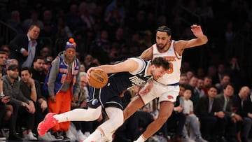 NEW YORK, NEW YORK - FEBRUARY 08: Luka Doncic #77 of the Dallas Mavericks drives against Jacob Toppin #00 of the New York Knicks during their game at Madison Square Garden on February 08, 2024 in New York City. User expressly acknowledges and agrees that, by downloading and or using this photograph, User is consenting to the terms and conditions of the Getty Images License Agreement.   Al Bello/Getty Images/AFP (Photo by AL BELLO / GETTY IMAGES NORTH AMERICA / Getty Images via AFP)