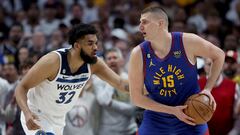 DENVER, COLORADO - APRIL 16: Nikola Jokic #15 of the Denver Nuggets is guarded by Karl-Anthony Towns #32 of the Minnesota Timberwolves in the first quarter during Round 1 Game 1 of the NBA Playoffs at Ball Arena on April 16, 2023 in Denver, Colorado. NOTE TO USER: User expressly acknowledges and agrees that, by downloading and/or using this photograph, User is consenting to the terms and conditions of the Getty Images License Agreement.   Matthew Stockman/Getty Images/AFP (Photo by MATTHEW STOCKMAN / GETTY IMAGES NORTH AMERICA / Getty Images via AFP)
