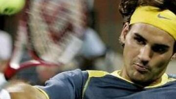 Federer vence a Santoro y pasa a la tercera ronda