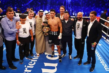 ABU DHABI, UNITED ARAB EMIRATES - NOVEMBER 05: Dmitrill Bivol celebrates victory with their team after the WBA Super World Light Heavyweight Title fight between Dmitrii Bivol and Gilberto Rmirez  at Etihad Arena on November 05, 2022 in Abu Dhabi, United Arab Emirates. (Photo by Francois Nel/Getty Images)