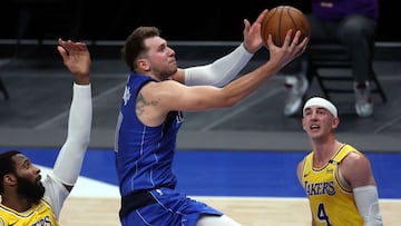DALLAS, TEXAS - APRIL 22: Luka Doncic #77 of the Dallas Mavericks takes a shot against the Los Angeles Lakers in the fourth quarter at American Airlines Center on April 22, 2021 in Dallas, Texas. NOTE TO USER: User expressly acknowledges and agrees that, by downloading and or using this photograph, User is consenting to the terms and conditions of the Getty Images License Agreement.   Ronald Martinez/Getty Images/AFP
 == FOR NEWSPAPERS, INTERNET, TELCOS &amp; TELEVISION USE ONLY ==