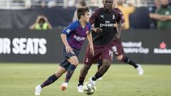 August 4, 2018; Santa Clara, CA, USA; FC Barcelona midfielder Ricky Puig (8, left) controls the ball against AC Milan midfielder Franck Kessie (79) during the second half in an International Champions Cup soccer match at Levi&#039;s Stadium. AC Milan defe