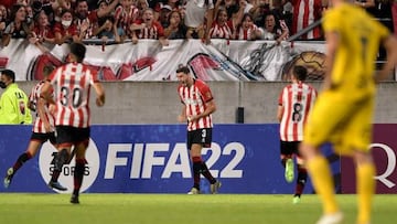 Argentina's Estudiantes de la Plata Agustin Rogel (C) celebrates after scoring against Chile's Everton during their Copa Libertadores third round second leg football match, at the Jorge Luis Hirschi stadium in La Plata, Argentina on March 16, 2022. (Photo by Juan Mabromata / AFP) (Photo by JUAN MABROMATA/AFP via Getty Images)