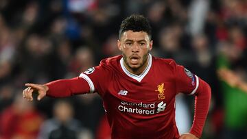 Liverpool's English midfielder Alex Oxlade-Chamberlain celebrates scoring the team's second goal during the UEFA Champions League first leg quarter-final football match between Liverpool and Manchester City, at Anfield stadium in Liverpool, north west England on April 4, 2018. / AFP PHOTO / Anthony Devlin