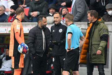 Manuel Neuer of FC Bayern Muenchen, Hasan Salihamidzic, Sporting Director of FC Bayern Muenchen, fourth official Arno Blos, match referee Christian Dingert and Julian Nagelsmann, Head Coach of FC Bayern Muenchen speak during the Bundesliga match