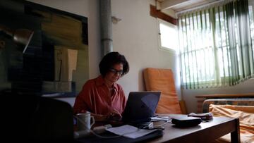 Psychoanalyst Roxana Meygide Schargorodsky works by video call with a patient, at her home in Buenos Aires, Argentina April 7, 2020. Picture taken April 7, 2020. REUTERS/Agustin Marcarian