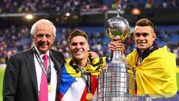 MADRID, SPAIN - DECEMBER 09: President of River Plate Rodolfo D'Onofrio (L) poses for a photo with Juan Fernando Quintero of River Plate (centre) after the second leg of the final match of Copa CONMEBOL Libertadores 2018 between Boca Juniors and River Plate at Estadio Santiago Bernabeu on December 9, 2018 in Madrid, Spain. Due to the violent episodes of November 24th at River Plate stadium, CONMEBOL rescheduled the game and moved it out of Americas for the first time in history. (Photo by Chris Brunskill/Fantasista/Getty Images)