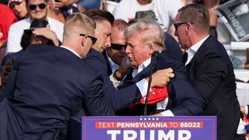 An apparent shooting has occurred at a Trump rally, with the former President being escorted away by security with blood on his face.