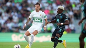 ELCHE, SPAIN - AUGUST 22: Pol Lirola of Elche is closed down by Largie Ramazani of Almeria during the LaLiga Santander match between Elche CF and UD Almeria at Estadio Manuel Martinez Valero on August 22, 2022 in Elche, Spain. (Photo by Aitor Alcalde/Getty Images)