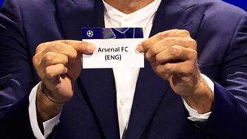 Italy's former goalkeeper Gianluigi Buffon shows the paper slip of Arsenal (ENG) during the group stage of the 2024-2025 UEFA Champions League football tournament, at the Grimaldi Forum in Monaco on August 29, 2024. (Photo by Valery HACHE / AFP)