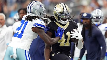 ARLINGTON, TEXAS - SEPTEMBER 15: Alvin Kamara #41 of the New Orleans Saints is pushed out of bounds by Caelen Carson #21 of the Dallas Cowboys during the second quarter at AT&T Stadium on September 15, 2024 in Arlington, Texas. Sam Hodde/Getty Images/AFP (Photo by Sam Hodde / GETTY IMAGES NORTH AMERICA / Getty Images via AFP)