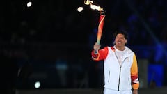 Chile's former footballer Ivan Zamorano carries the torch to light the Cauldron of the Pan American Games Santiago 2023 during the opening ceremony, at the National Stadium in Santiago on October 20, 2023. (Photo by RAUL ARBOLEDA / AFP)