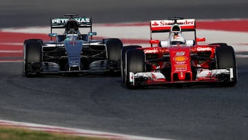 Sebastian Vettel of Germany and Ferrari drives ahead of Nico Rosberg of Germany and Mercedes GP during day two of F1 winter testing at Circuit de Catalunya on February 23, 2016 in Montmelo, Spain.