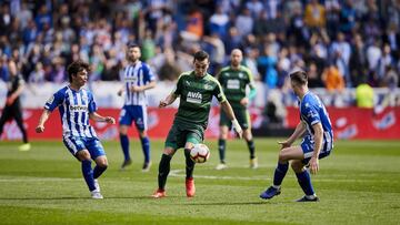 Vitoria, northern Spain, Saturday, March, 09, 2019. Gonzalo Escalante, Takashi Inui, Adrian Marin during the Spanish La Liga soccer match between Deportivo Alaves and S.D Eibar at Mendizorroza stadium.