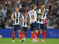 Monterrey's Spanish midfielder #10 Sergio Canales celebrates after scoring the opening goal from the penalty spot with teammate midfielder #05 Fidel Ambriz during the Liga MX Apertura football tournament match between Monterrey and Tigres at BBVA Stadium in Monterrey, Mexico on November 1, 2025. (Photo by Julio Cesar AGUILAR / AFP)