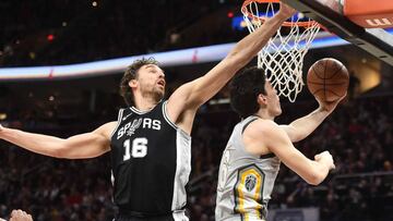 Feb 25, 2018; Cleveland, OH, USA; Cleveland Cavaliers forward Cedi Osman (16) drives to the basket against San Antonio Spurs center Pau Gasol (16) during the first half at Quicken Loans Arena. Mandatory Credit: Ken Blaze-USA TODAY Sports