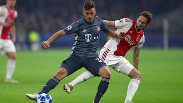Joshua Kimmich of Bayern Munich and Daley Blind of Ajax in action during the UEFA Champions League Group E