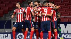 Atletico Madrid&#039;s Belgian midfielder Yannick Ferreira-Carrasco (R) celebrates his goal with teammates during the Spanish league football match Club Atletico de Madrid against Real Sociedad at the Wanda Metropolitano stadium in Madrid on May 12, 2021.