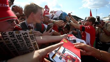 BUDAPEST, HUNGARY - JULY 26:  Sebastian Vettel of Germany and Ferrari signs autographs for fans during previews ahead of the Formula One Grand Prix of Hungary at Hungaroring on July 26, 2018 in Budapest, Hungary.  (Photo by Charles Coates/Getty Images)