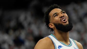 MINNEAPOLIS, MINNESOTA - APRIL 20: Karl-Anthony Towns #32 of the Minnesota Timberwolves reacts during the first quarter in game one of the Western Conference First Round Playoffs against the Phoenix Suns at Target Center on April 20, 2024 in Minneapolis, Minnesota. NOTE TO USER: User expressly acknowledges and agrees that, by downloading and or using this photograph, User is consenting to the terms and conditions of the Getty Images License Agreement.   Patrick McDermott/Getty Images/AFP (Photo by Patrick McDermott / GETTY IMAGES NORTH AMERICA / Getty Images via AFP)