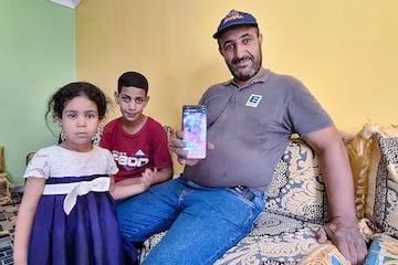 Omar Khelif, the father of Algerian boxer Imane Khelif, shows a picture of his daughter as a child.