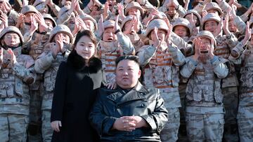 North Korean leader Kim Jong Un and his daughter attend a photo session with the scientists, engineers, military officials and others involved in the test-fire of the country's new Hwasong-17 intercontinental ballistic missile (ICBM) in this undated photo released on November 27, 2022 by North Korea's Korean Central News Agency (KCNA) KCNA via REUTERS    ATTENTION EDITORS - THIS IMAGE WAS PROVIDED BY A THIRD PARTY. REUTERS IS UNABLE TO INDEPENDENTLY VERIFY THIS IMAGE. NO THIRD PARTY SALES. SOUTH KOREA OUT. NO COMMERCIAL OR EDITORIAL SALES IN SOUTH KOREA.