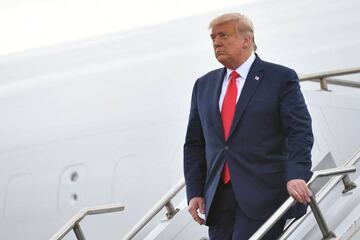 US President Donald Trump steps off Air Force One upon arrival at Ocala International Airport in Ocala, Florida on October 23, 2020. - The President has two rallies scheduled in Florida today. 