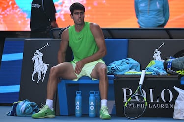 MELBOURNE, AUSTRALIA - JANUARY 30: Carlos Alcaraz of Spain stretches his leg in the Men's Singles Semifinal match against Alexander Zverev of Germany during day 13 of the 2026 Australian Open at Melbourne Park on January 30, 2026 in Melbourne, Australia. (Photo by Quinn Rooney/Getty Images)