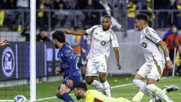 Hugo Lloris (L) of Los Angeles fights for the ball with Miguel Ramirez (R) of America during the match between Los Angeles FC and America as part of the friendly match, at Banc of California Stadium on February 11, 2025 in Los Angeles, California, United States.