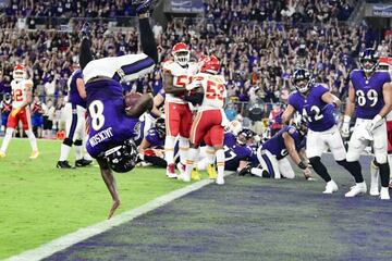 Lamar Jackson (8) flips into the end zone