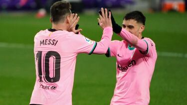 Barcelona's Argentine forward Lionel Messi (L) celebrates with Barcelona's Spanish midfielder Pedri after scoring a goal during the Spanish league football match between Real Valladolid FC and FC Barcelona at the Jose Zorilla stadium in Valladolid on Dece