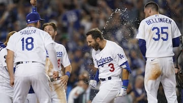 The Los Angeles Dodgers celebrate with Chris Taylor (3) after he hit a home run during the ninth inning to win a National League Wild Card playoff baseball game 3-1 over the St. Louis Cardinals Wednesday, Oct. 6, 2021, in Los Angeles. Cody Bellinger (35) 