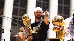 Finals MVP Stephen Curry acknowledges the cheers of the crowd, during a parade for the NBA Champion Golden State Warriors