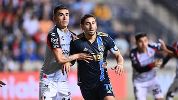 Apr 4, 2023; Chester, PA, USA; Philadelphia Union midfielder Alejandro Bedoya (11) and Atlas FC defender Luis Reyes (14) battle for position in the first half at Subaru Park. Mandatory Credit: Kyle Ross-USA TODAY Sports